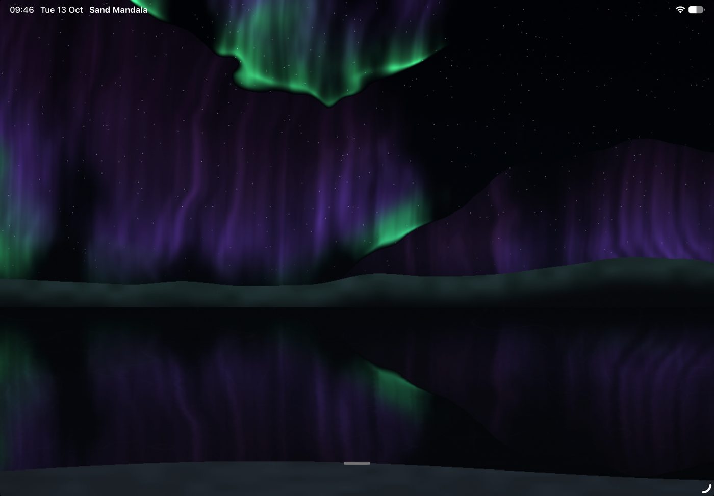 The northern lights over a still lake at night.